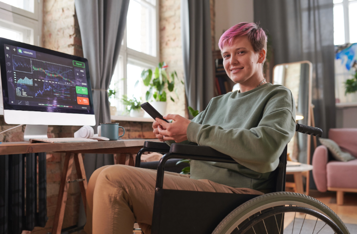 Woman in wheelchair using audio engineering software