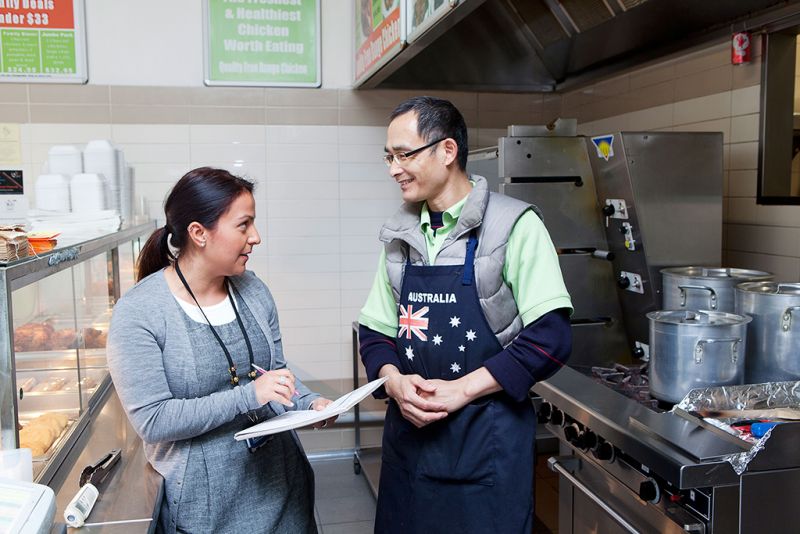 Council officer visiting a business.